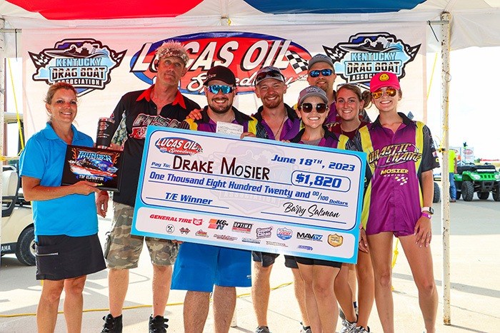 Drake Mosier celebrates with his “Drastic Change” team in the Top Eliminator Winner’s Circle.